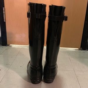Glossy black adjustable tall hunter boots